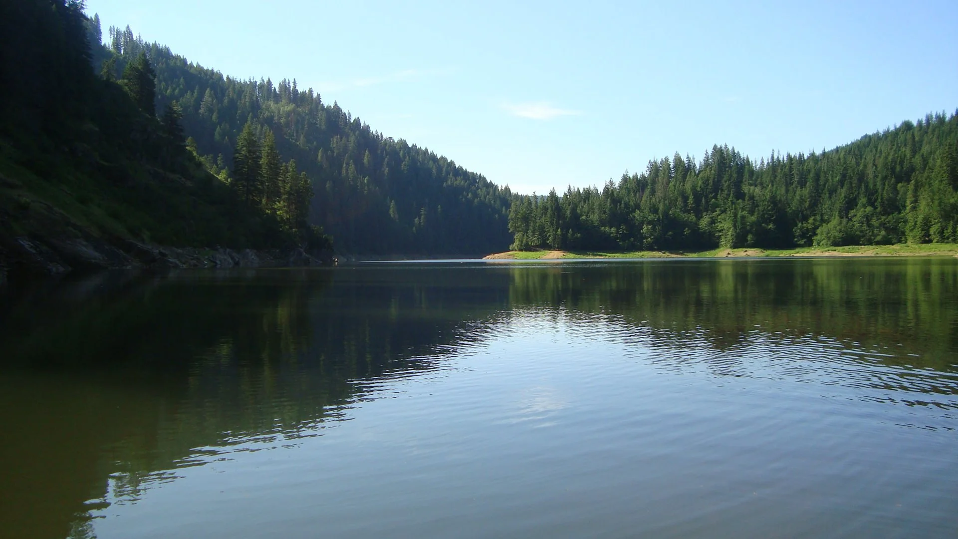 Forested lake from the original Caldwell Recovery Center site